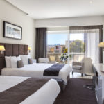 A bedroom in the George Urban Boutique Hotel