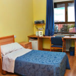 Una stanza da letto del residence studentesco Cum Laude 