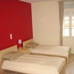 Una stanza da letto doppia del residence ILA