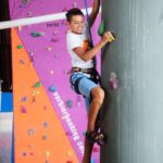 Altitude Summer Camp camper does indoor climbing