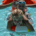 Camp Twin Creeks camper at the camp pool