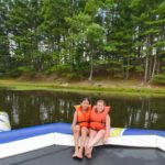 Camp Twin Creeks campers on a water trampoline
