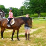 Camp Twin Creeks campers have horse riding lessons