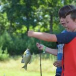 Camp Twin Creeks camper goes fishing