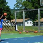 Camp Twin Creeks camper plays basketball