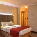 Una stanza da letto della Suite Executive della Casa Vancouver