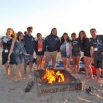 FLS international Los Angeles Cal State Fullerton students have a bonfire at the beach