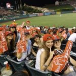 FLS international Los Angeles Cal State Fullerton students watch a baseball game