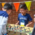 Summer Boarding Courses Oxford Summer School students play table soccer