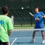 World Sports Camp students play tennis