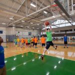 World Sports Camp students play basketball