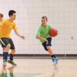 World Sports Camp students play basketball