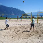 Alpadia Montreux French Summer Camp students play beach volleyball