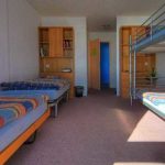 Una stanza quadrupla nell'alloggio dei Village Camps Leysin Summer Camp