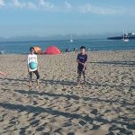 Tamwood San Francisco Summer Camp students play games at the beach
