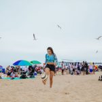 Rennert Academy Plus! and Summer Adventure students play soccer at the beach