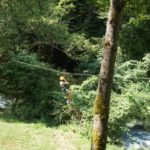 Alphabet Outdoor Exploration Camp students go ziplining