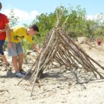 Alphabet Outdoor Exploration Camp students learn survival skills