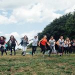 Alphabet Outdoor Exploration Camp students do team activities