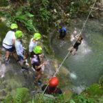 Alphabet Outdoor Exploration Camp students go ziplining