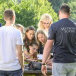 Sevenoaks Summer School students relax in the park