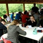 friLingue Estavayer Summer Camp students have class outside