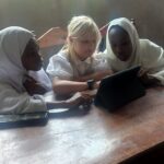 Students at Kwetu School learning digital literacy on a tablet for the first time