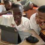 Ghomme students learning cybersecurity on the organization's Cisco Networking Academy