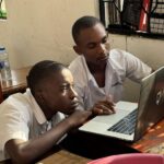 Ghomme students learning cybersecurity on the organization's Cisco Networking Academy