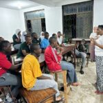 A volunteer describes her journey from accounting to running a successful tourism business in Arusha to high school students