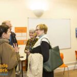 Rachel chats with school owners at a school reception in Leeds, UK, in 2016.