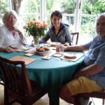 A student having dinner with an English in Chest host family