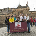 CES Edinburgh students in front of Edinburgh castle