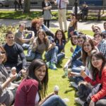 CES Leeds students eat ice cream on the grass