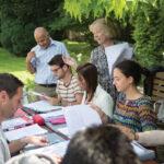 Cambridge Academy of English class in the garden