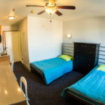 A twin bedroom in the Vantaggio State Street student residence