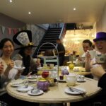 English in Chester students have a Mad Hatters afternoon tea