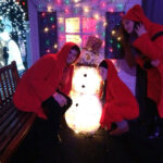 Rennert International students go to a New York rooftop restaurant at Christmas