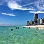 Rennert International Miami school students swimming at the beach