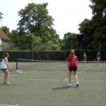 Sir Christopher students playing tennis