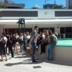 TLA students socialize in the plaza outside the school