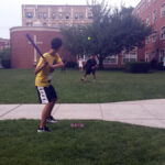 FLS New York students play a game of softball on the lawn