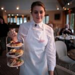 A waitress at Betty's Tea Rooms