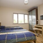 A twin bedroom in Auburn House