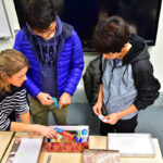 Students prepare gift boxes at Christmas for charity