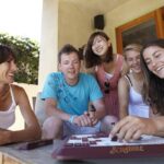 ELC Los Angeles students play Scrabble with their host mother
