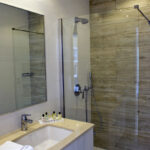 The bathroom in a Salini Resort guest studio