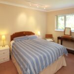 A bedroom in the Rosa Executive Apartments