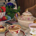 A traditional English cream tea on vintage china at the Cox and Baloney tea room in Bristol