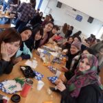 Studio Cambridge students have a snack